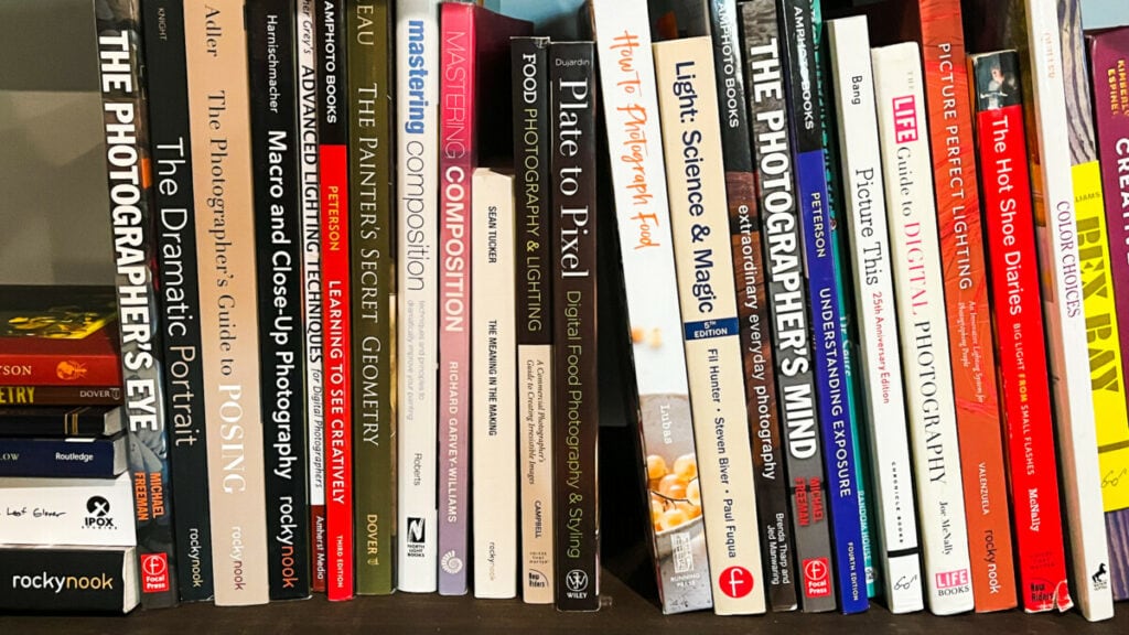 A shelf of books about food photography
